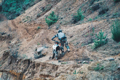 Man riding bicycle on road