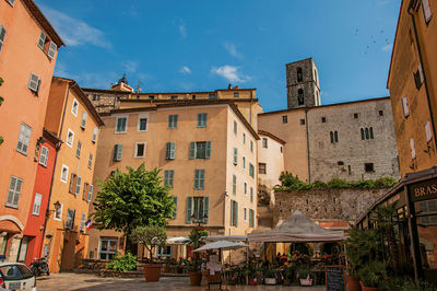 Buildings and houses against sky in city