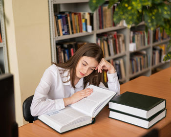 Young woman reading book