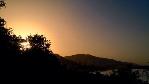 Scenic view of mountains at sunset