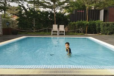 Woman swimming in pool
