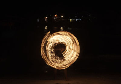 Blurred motion of illuminated lighting equipment at night