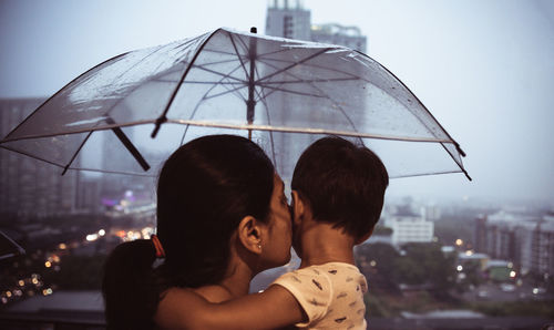 Portrait of friends against cityscape in city