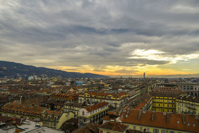 High angle shot of townscape against sky at sunset