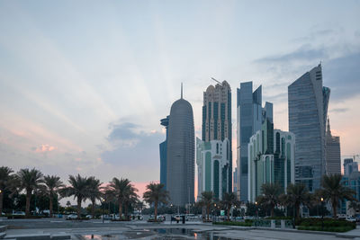 Modern buildings in city against sky