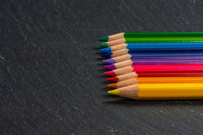 High angle view of colored pencils on table