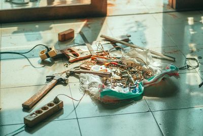 High angle view of painting on tiled floor