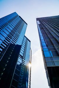 Low angle view of modern buildings against sky