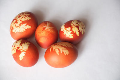 Close-up of eggs on white background