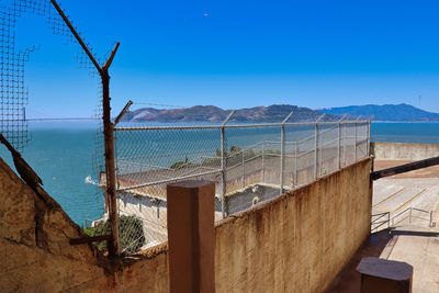 Scenic view of sea against clear blue sky