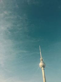 Low angle view of communications tower against sky