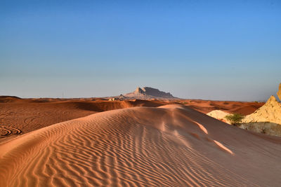 Scenic view of desert against clear sky