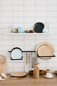 Kitchen utensils and utensils in the bright white wooden kitchen