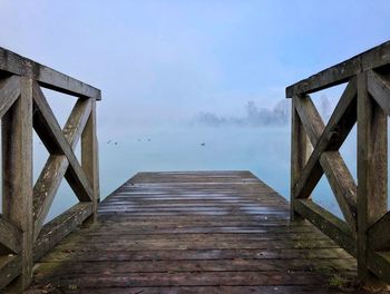 View of pier on sea against sky