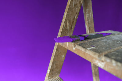 Low angle view of metallic structure on blue table