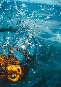 Close-up of water splashing on bucket