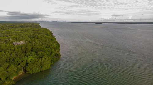 High angle view of sea shore against sky