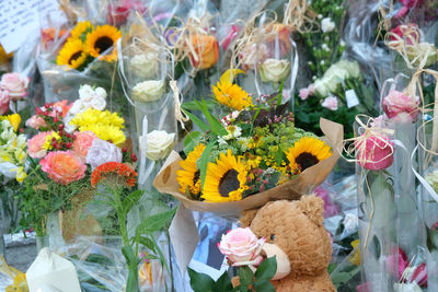 Multi colored flower pots for sale at market stall