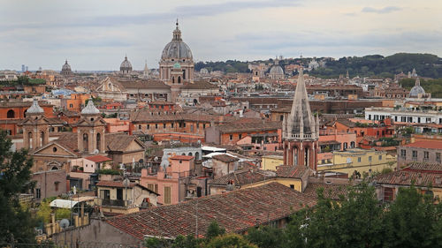 High angle view of buildings in city against sky