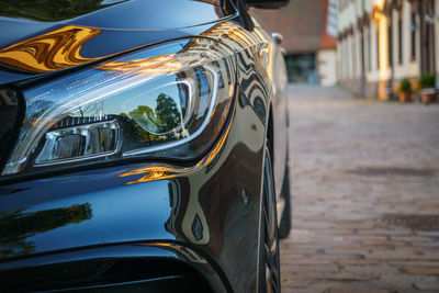 Close-up of car on street