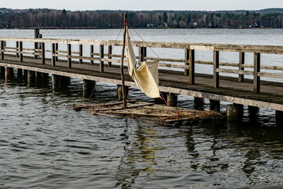 Wooden posts in river