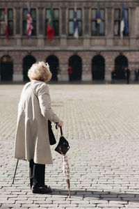 Full length rear view of man walking outdoors