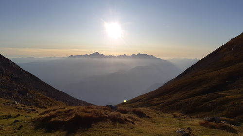 Scenic view of mountains against sky during sunset