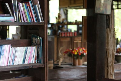 Flower pots on shelf at home