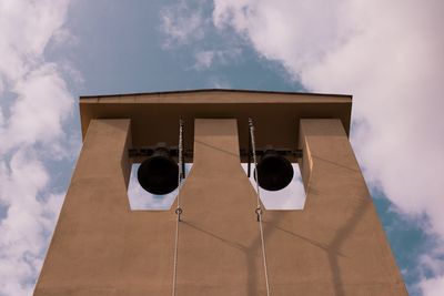 Low angle view of bell tower against sky