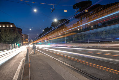 Light trails on road in city at night