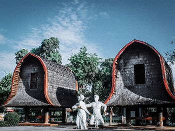 Low angle view of a sculpture against building