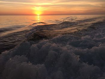 Scenic view of sea at sunset