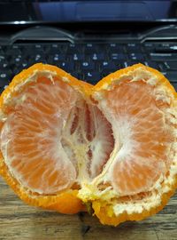 Close-up of orange slice on table