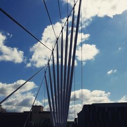 Low angle view of cables against sky