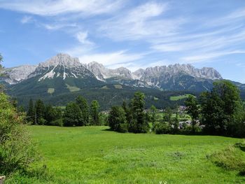 Scenic view of landscape and mountains against sky