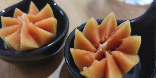 High angle view of chopped fruits in bowl on table