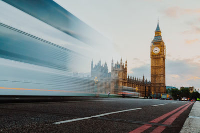Clock tower in city against sky