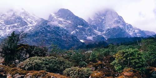 Scenic view of snowcapped mountains against sky