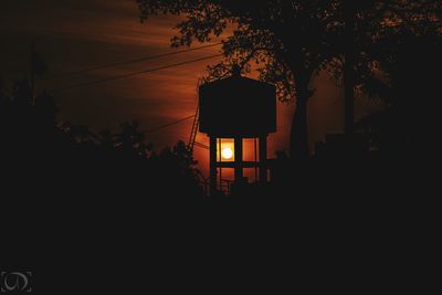 Silhouette trees against sky during sunset