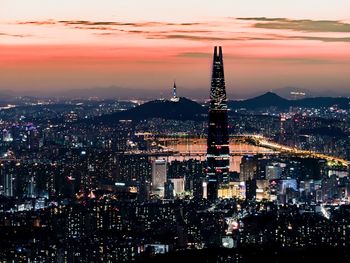 Illuminated cityscape at dusk