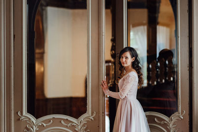 Portrait of smiling young woman standing outdoors