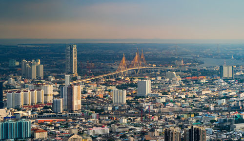 High angle view of modern buildings in city against sky