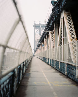 Footpath on manhattan bridge against sky