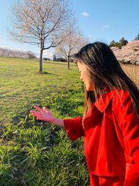 Side view of a girl in a field