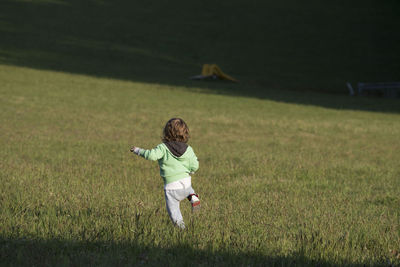 Full length of boy on field