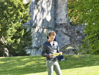 Full length of young man looking at camera