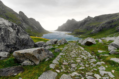 Hiking trail leading to the remote village vinstad near bunes beach and reine in lofoten norway.