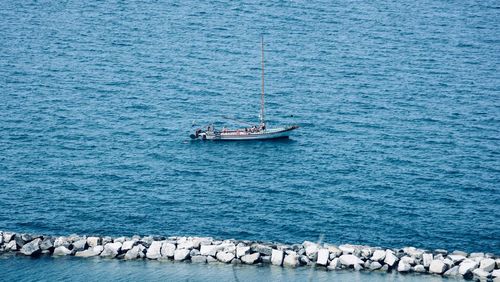 High angle view of sailboats sailing on sea