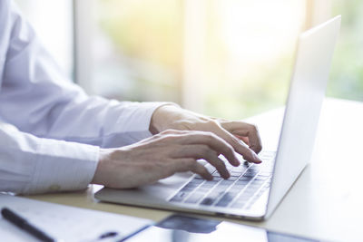 Man using laptop on table