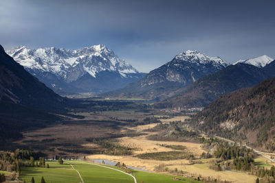 Scenic view of snowcapped mountains against sky